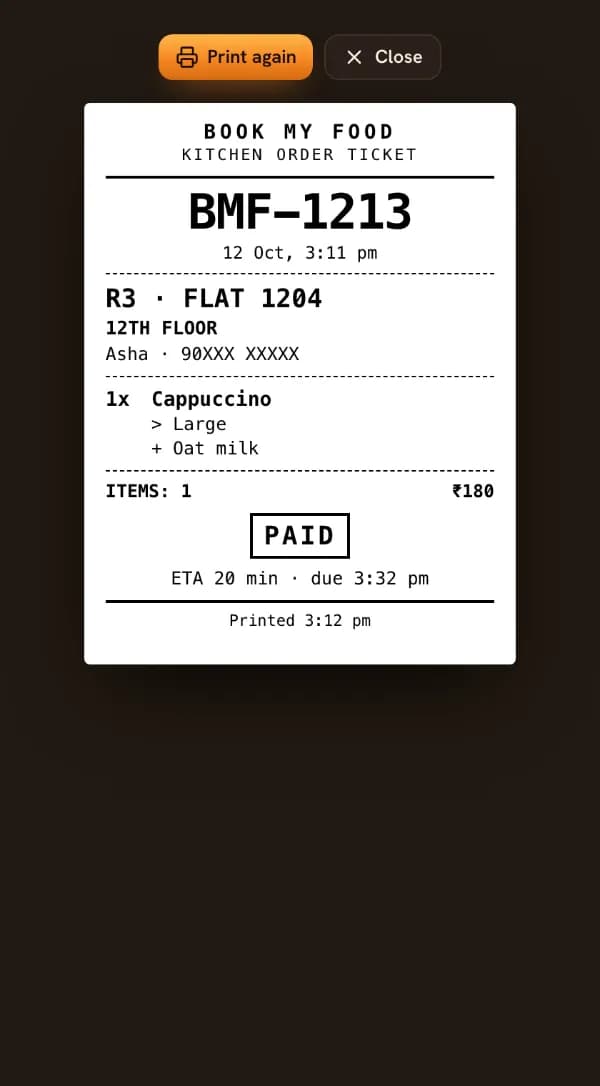 A kitchen order ticket: BOOK MY FOOD, KITCHEN ORDER TICKET, the order code, R3 · FLAT 1204, 12TH FLOOR, 1x Cappuccino with Large and Oat milk, PAID and the ETA.