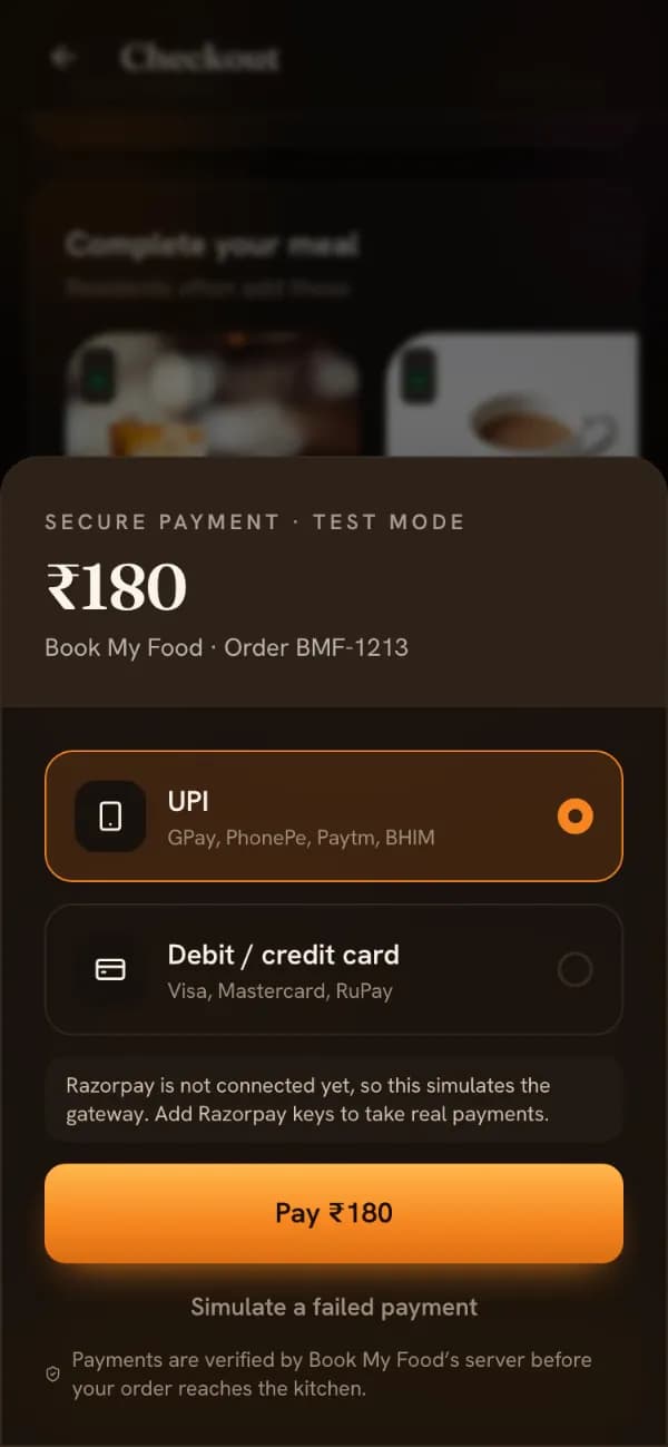The simulated payment screen on the demo store, labelled Secure payment · Test mode, with UPI and card options, a Pay button and “Simulate a failed payment”.
